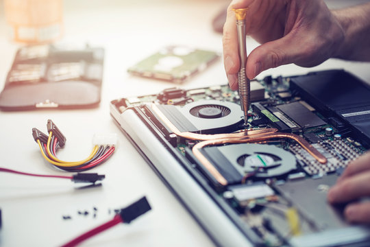 Technician repairing a laptop